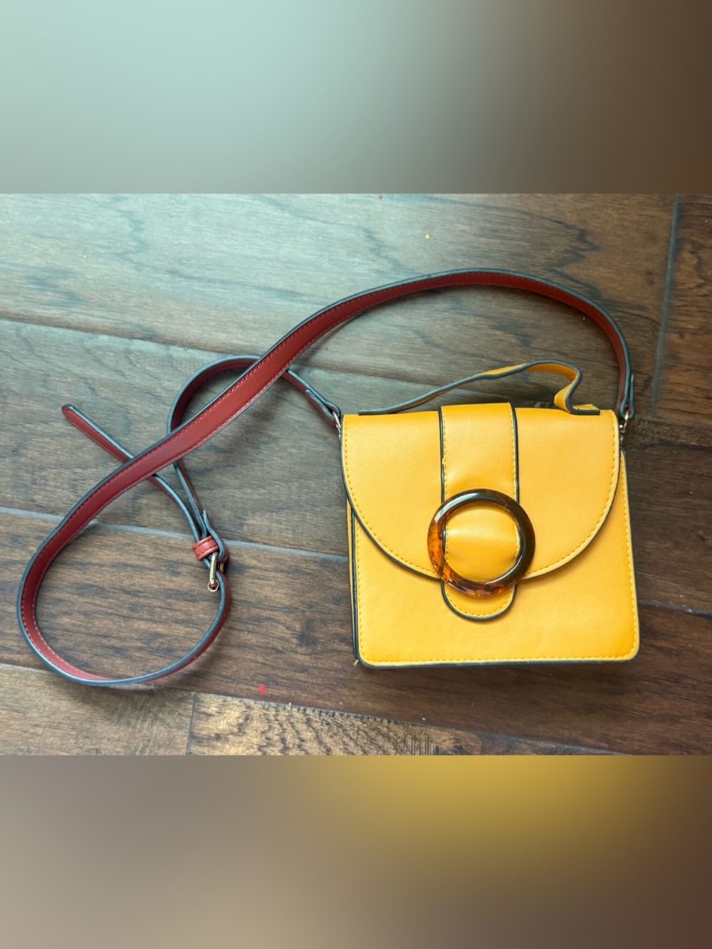 Compact Yellow Crossbody Bag with Tortoiseshell Ring Accent